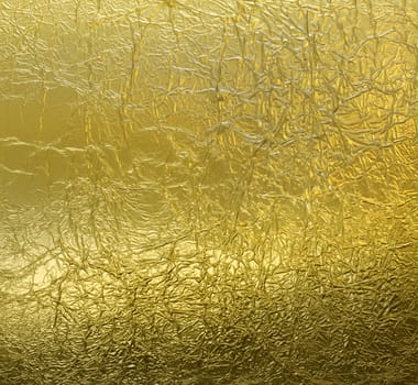 Wrinkled leaf gold foil pattern reflective texture background