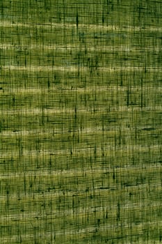 Light stripes on green woven linen curtain