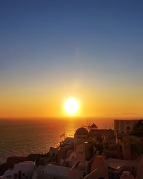 Famous sunset in Oia village Santorini island Greece