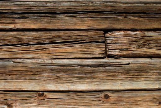 Old brown wooden log house wall detail horizontal
