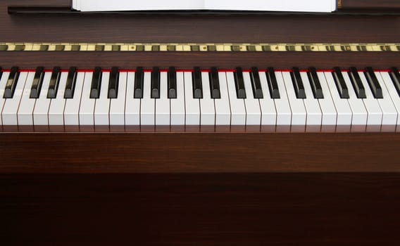 Classic upright piano keyboard black and white front view