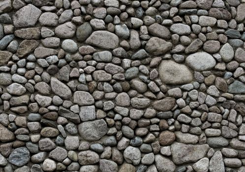 Round gray granite stone wall pattern background