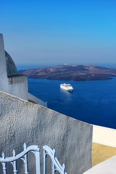 View to Santorini caldera with luxury cruiser ship