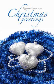 Silver Christmas hearts on blue decoration garland background