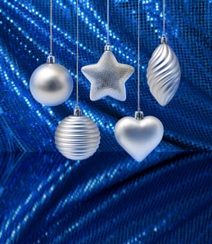 Silver Christmas decoration on blue curtain background