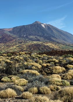 El Teide volcano mountain summit and surronding colorful desert