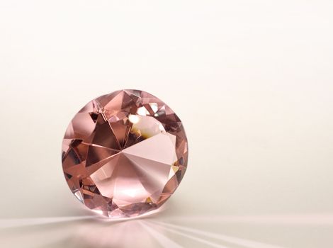 Topaz gemstone diamond shining on light pink background