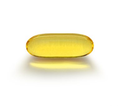 Transparent yellow fluid content medicine capsule on white background