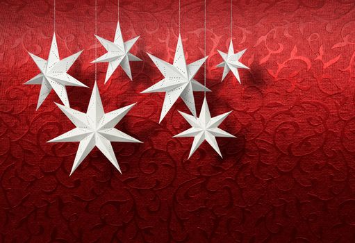 White paper stars on vivid red Christmas brocade pattern background