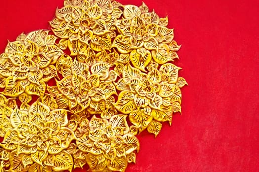 The gold stucco design of native thai style on the Wall