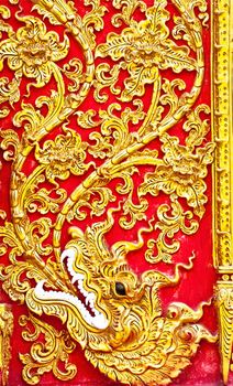 The gold stucco design of native thai style on the Wall