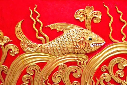 The gold stucco design of native thai style on the Wall