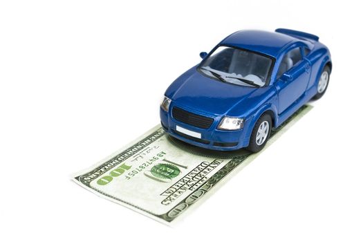 Blue car model and dollar on white