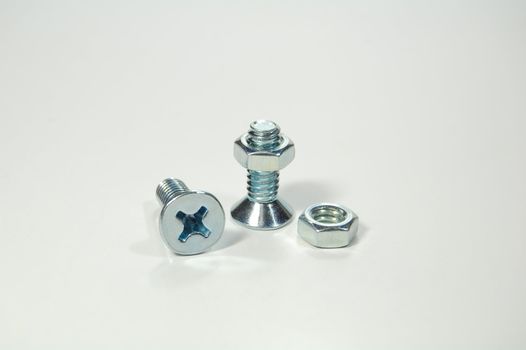 A set of shiny metal nuts and bolts for do-it-yourself stuff or repairing/replacing old parts