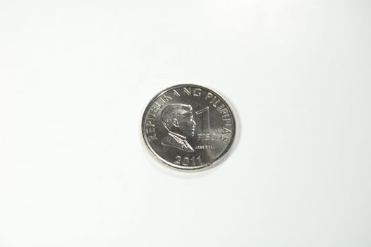 A shiny silvery 1-peso coin
