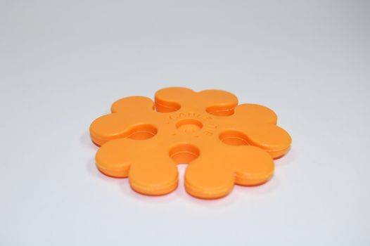 yellow plastic cable tie on white background