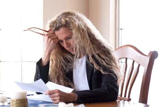 woman worried about bills and debt and foreclosure