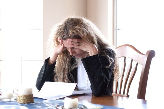 woman worried about bills and debt and foreclosure