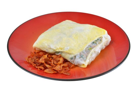 Vietnamese rice noodle rolls with a filling of pork sliced and egg ,  fried onion on red dish