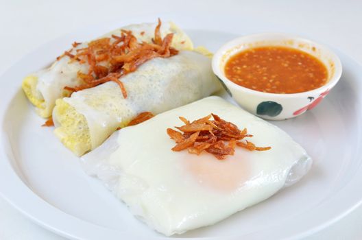 mixed vietnamese rice noodle rolls with a filling of pork sliced and egg ,  fried onion