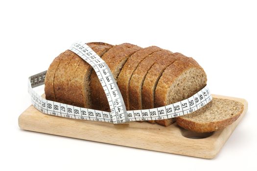 Sliced bread and measure band. Diet concept