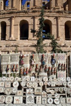 Souvenirs and wall of roman theater in El-Jem, Tunisia           