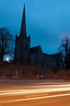Saint James church in Mallow town, Ireland (sunset picture with car trails)