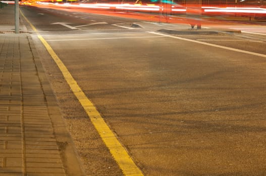 night traffic on a urban road with car trails (long exposure)