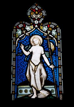 religious stained glass window in Gloucester Cathedral, England (United Kingdom) (isolated on black background)