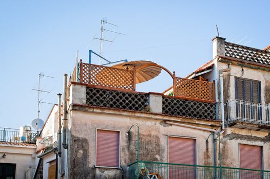 Old house with antennas on the roof, taien in naples, italy