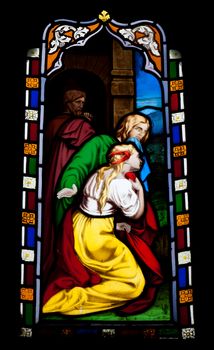 religious stained glass window in Gloucester Cathedral, England (United Kingdom) (isolated on black background)