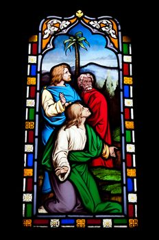 religious stained glass window in Gloucester Cathedral, England (United Kingdom) (isolated on black background)