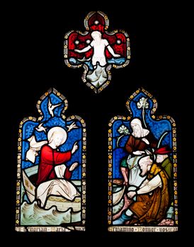 religious stained glass windows in Gloucester Cathedral, England (United Kingdom) (isolated on black background)