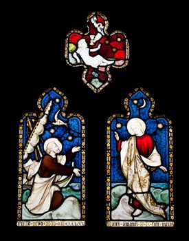 religious stained glass windows in Gloucester Cathedral, England (United Kingdom) (isolated on black background)