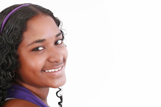 Beautiful smiling face of a happy African teenager girl, isolated.