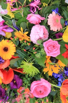 Combination of many different flowers in bright colors in a spring bouquet