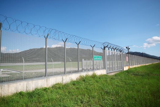 palisade on green yellow meadow 