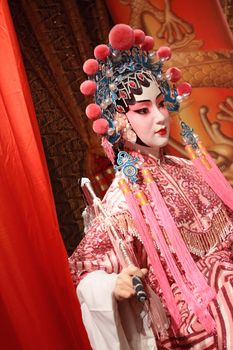 chinese opera dummy and red cloth as text space ,it is a toy,not real man 