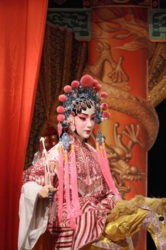 chinese opera dummy and red cloth as text space ,it is a toy,not real man 