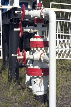 bound white fuel pipes with the red gates, making industrial system
