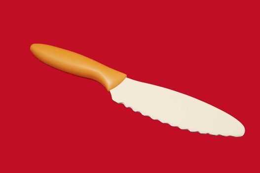 knife with a ceramic coating on a red background