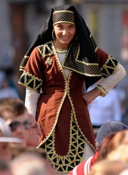 August 30st, 2011 - The annual celebration of Tatarstan Republic Day in Kazan is a colourful event, where the numerous local ethnics groups in traditional costumes perform in dances and singings. In this picture, a Dagestanian girl is waiting for her dancing round.