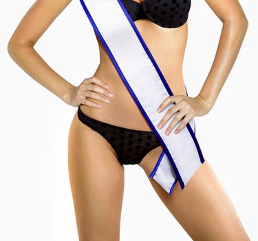 part of woman shape of beautiful thigh in bikini with white tape of beauty contest with path