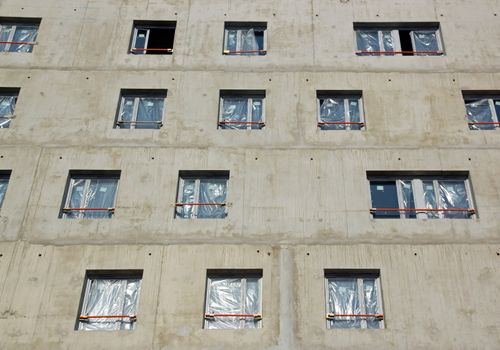 Laying windows, building under construction