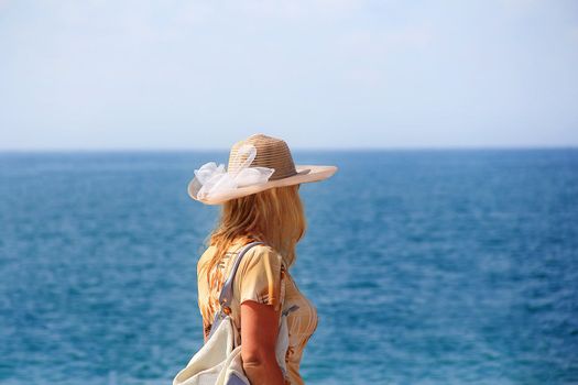 Image of girl are looking and awaiting to sea distance