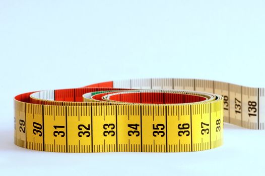 Yellow measuring tape with black numbers