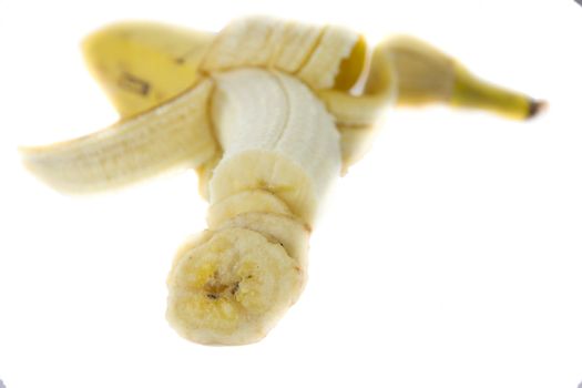 Picture of a fresh banana with dried banana slices in front