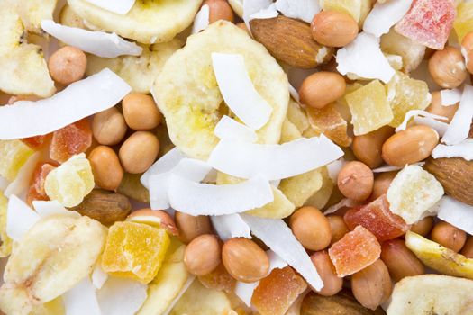 closeup picture of a bunch of nuts and dried fruits together