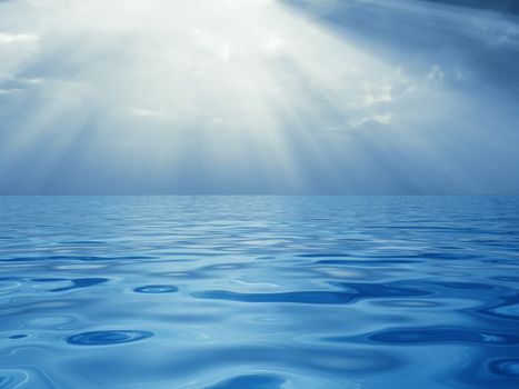 Solar beams breaking through clouds above a quiet surface of ocean