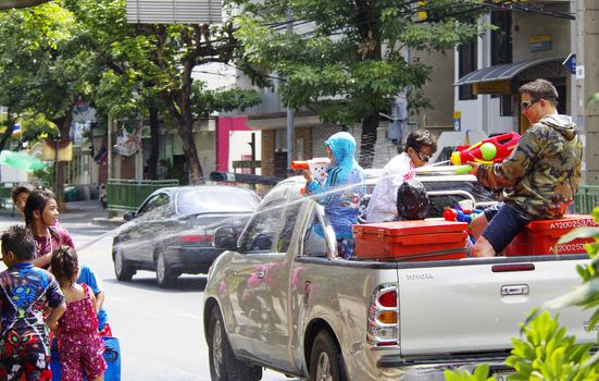 BANGKOK - APRIL 14 2012: Songkran (thai new year / water festival) is celebrated from april 13 to 15. people roam the streets and drench each other and passersby with water